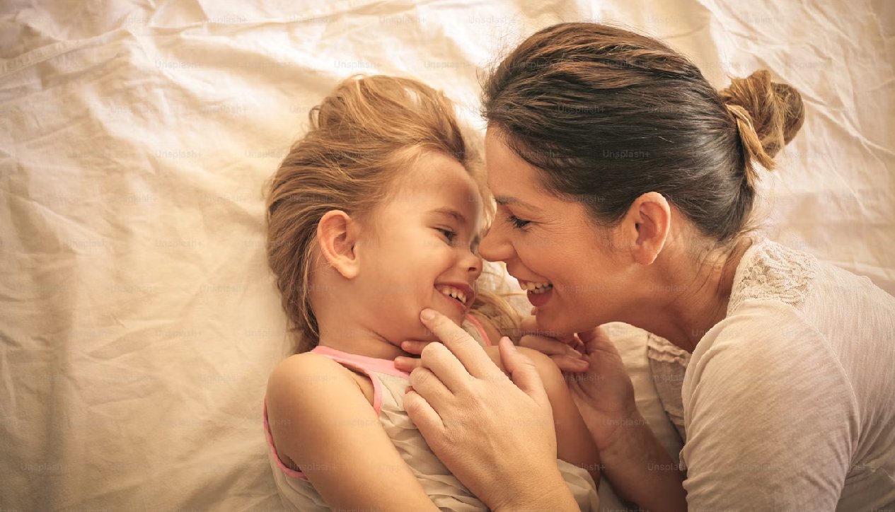 Mother and daughter smiling together